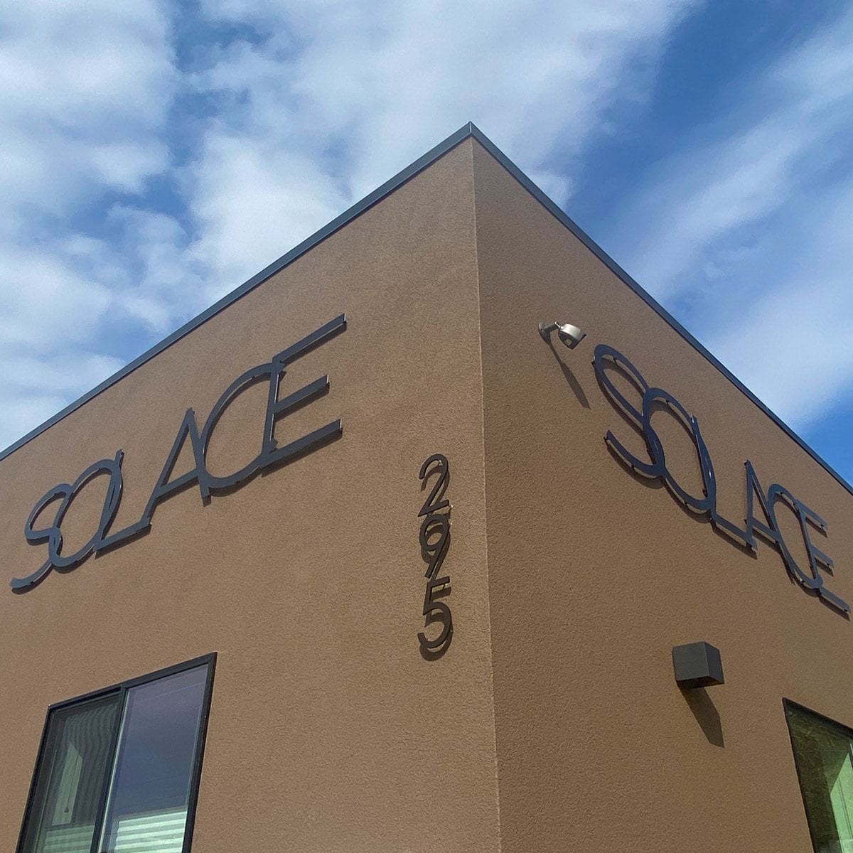 Solace building logos plasma cut out of 12g steel and powder coated matte black.