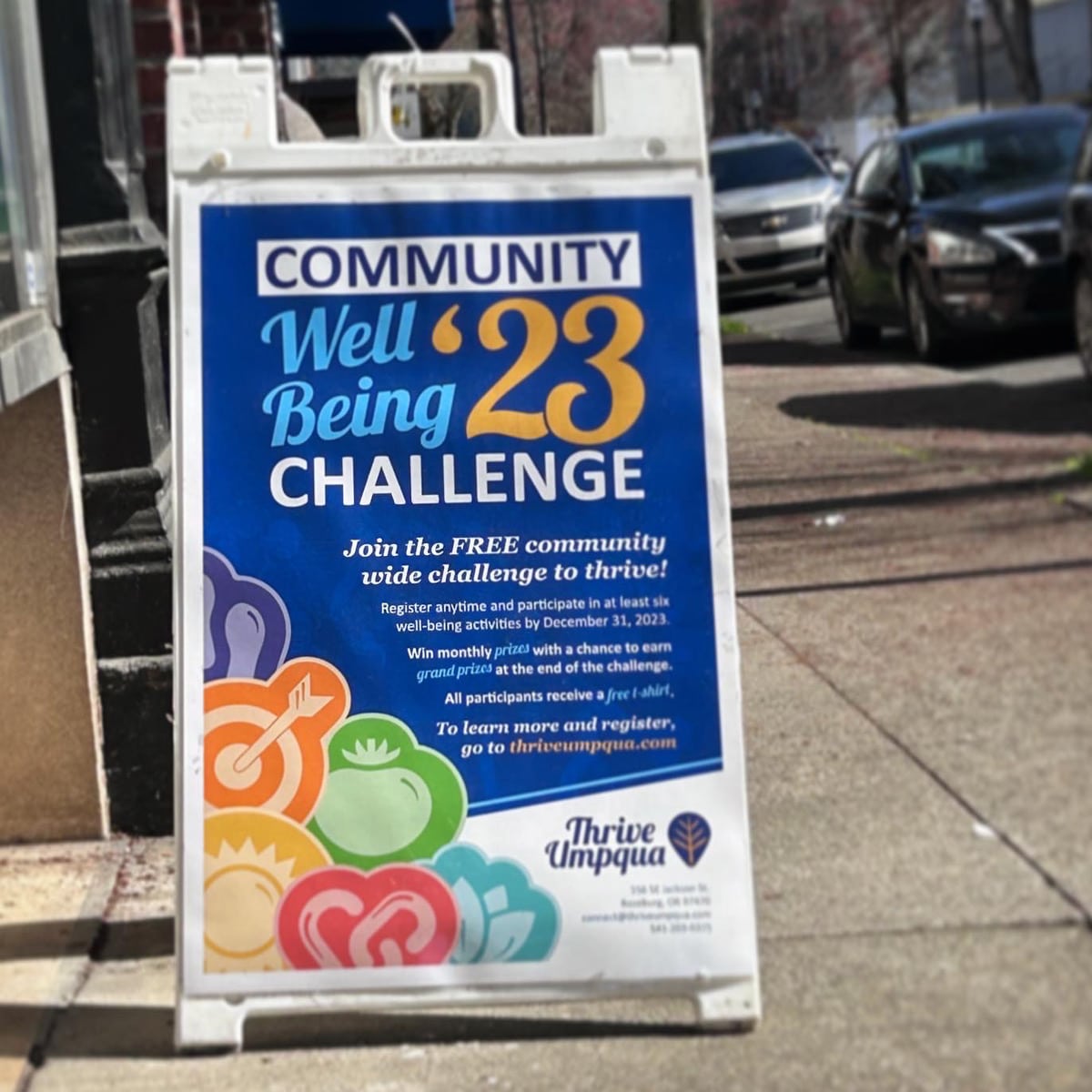 Thrive Umpqua sandwich board for the Community Well Being Challenge.